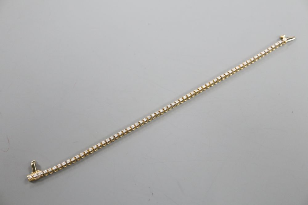 A modern 9ct gold and diamond set line bracelet, 17.7cm, gross 7 grams,